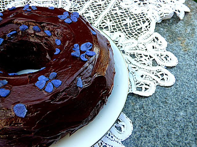 Chocolate bundt cake with crystallised violet petals