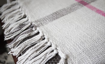 White blanket with grey stripes