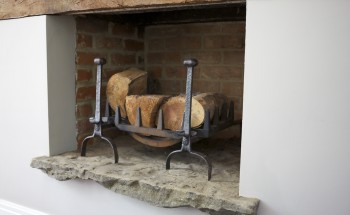 Stone fireplace with wood